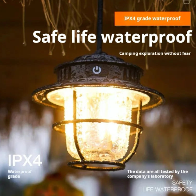 Camping lamp with IPX4 waterproof rating, glowing in a dark setting.